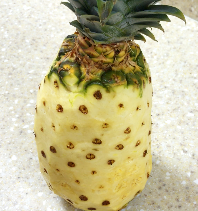 Pineapple with outer skin removed