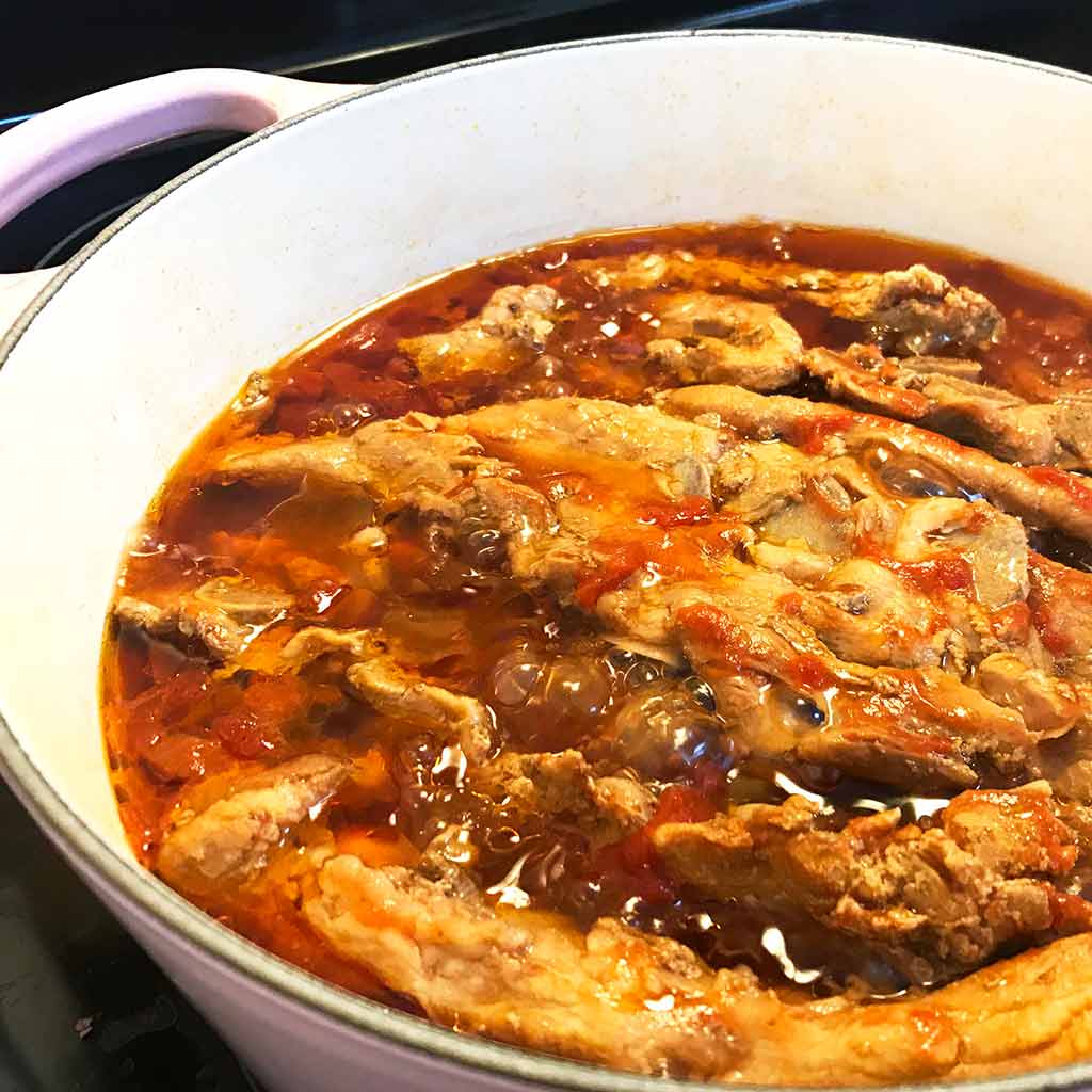 pork rib tip stew in a dutch oven